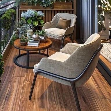 Urban Balcony Sanctuary Two Upholstered Lounge Chairs With Round Wooden Coffee Table