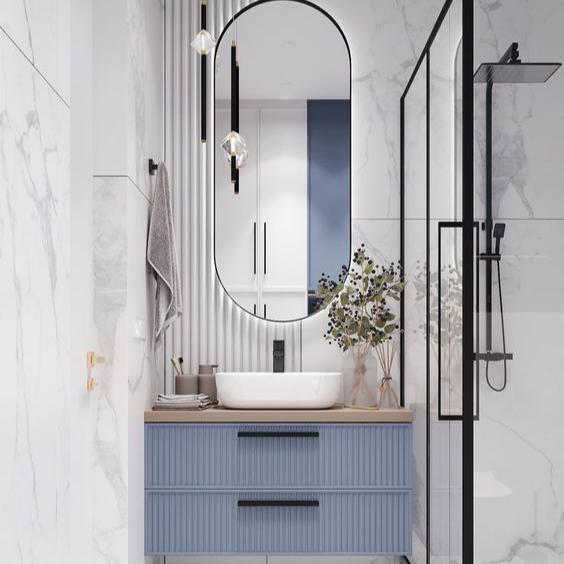 A Modern Floating Bathroom Vanity with Ribbed Blue Cabinetry, Neutral Countertop, and Elegant Vessel Sink Design