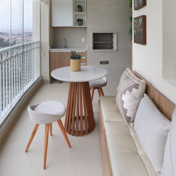 A Space For Unwinding And Entertaining Circular Wooden Table With Two Contemporary Stools