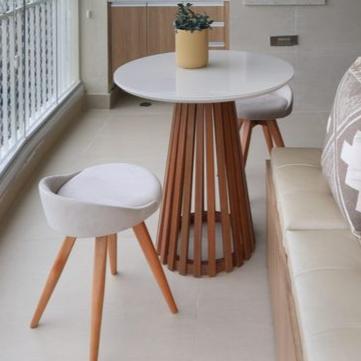 A Space For Unwinding And Entertaining Circular Wooden Table With Two Contemporary Stools